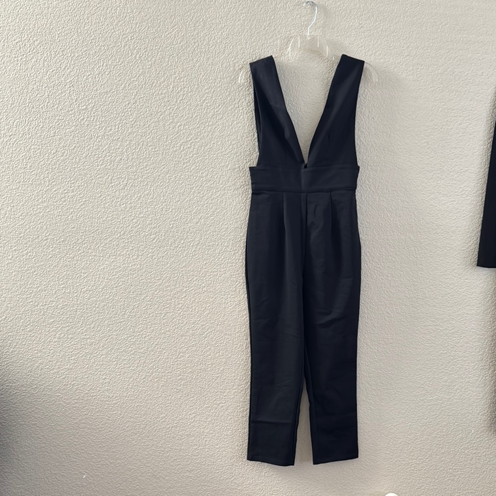 by the way. Black Deep V-Neck Jumpsuit